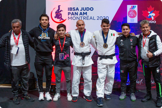 Athletes team posing with medals